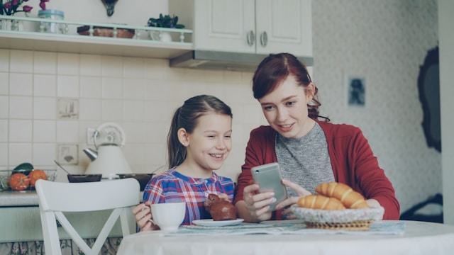a-mother-and-daughter-share-a-phone-together